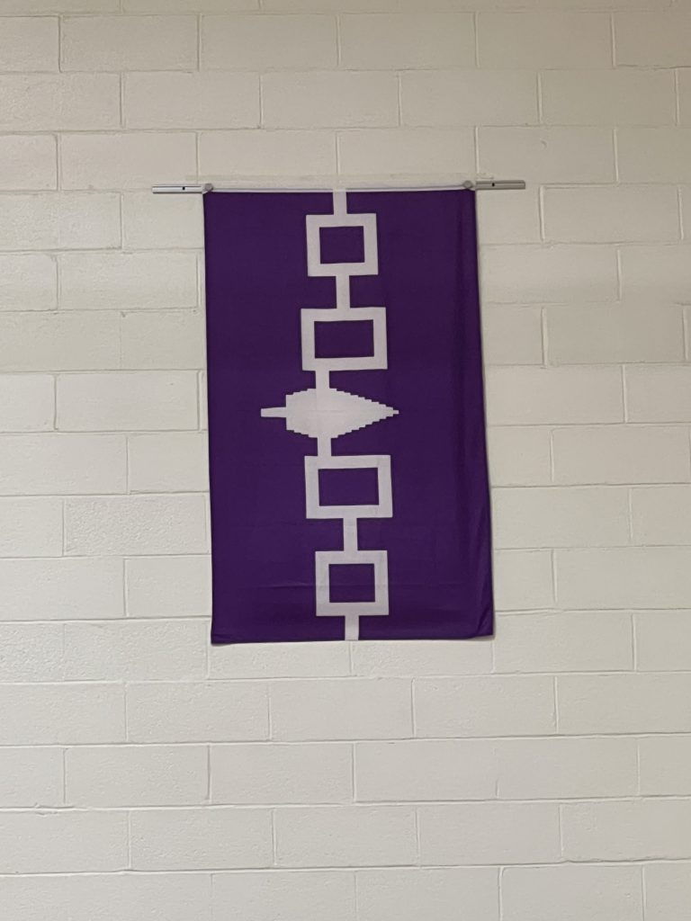 The flag mounted on the gym wall