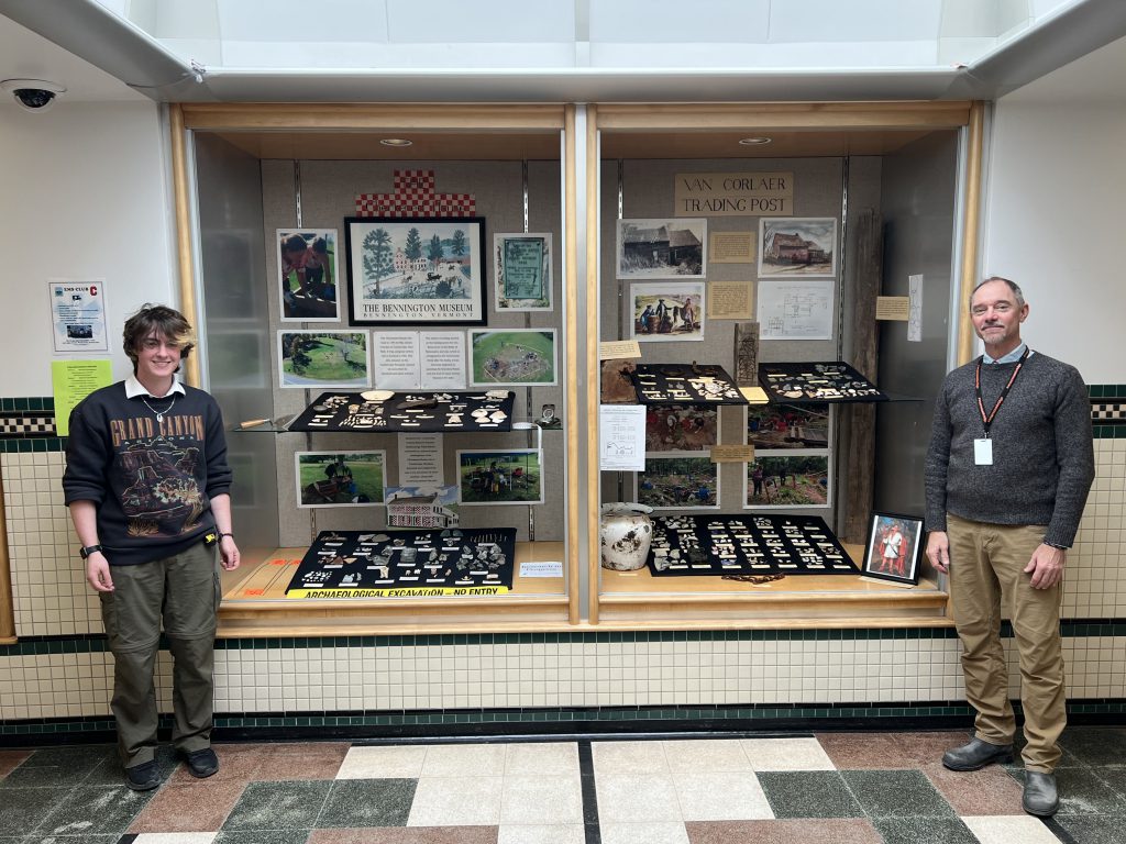 Rahe and Steve posing in front of the display cases
