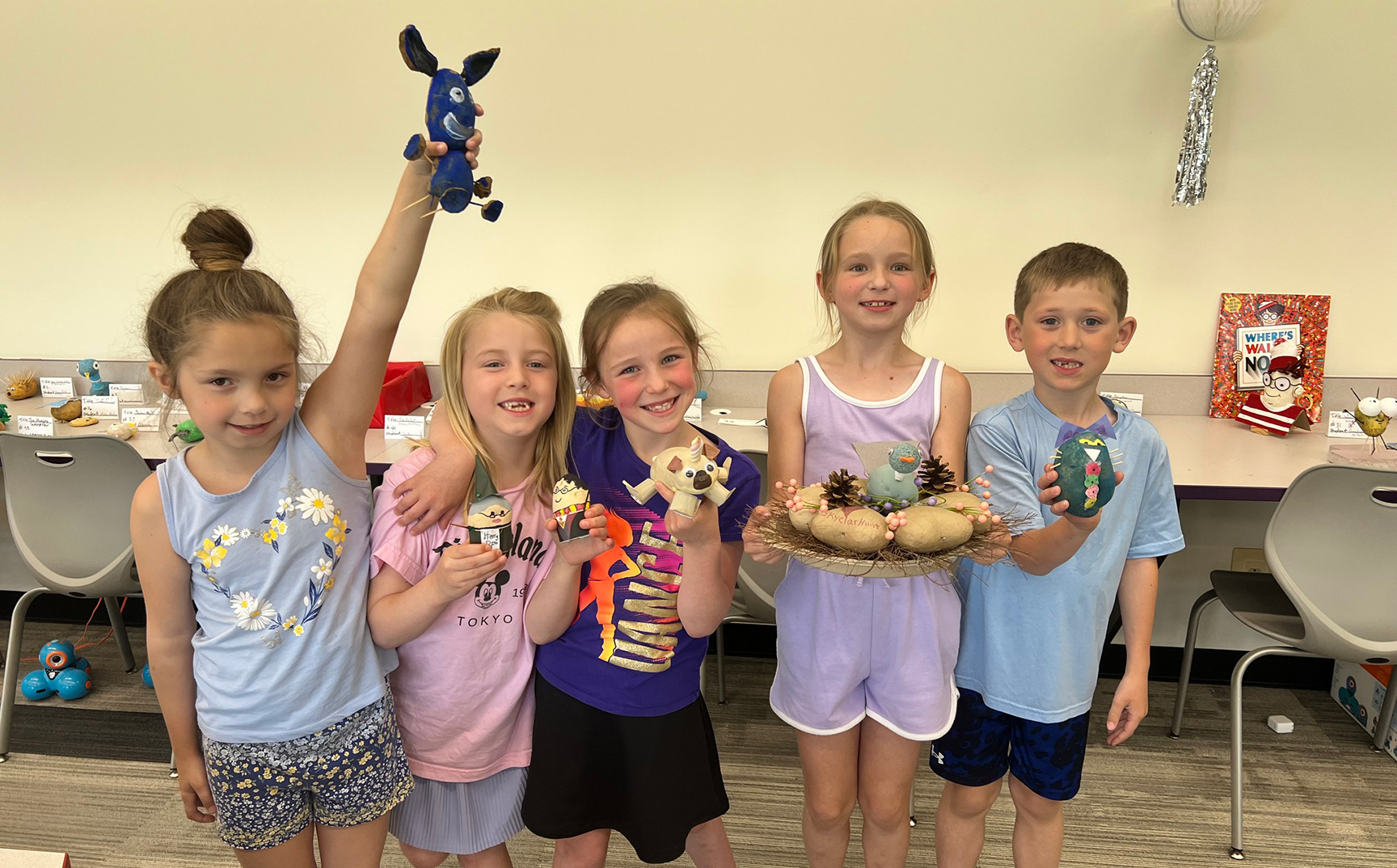 Elementary students with their potato creations