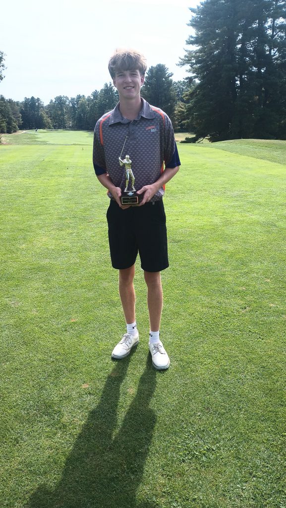 Luke MacDougall posing with his trophy