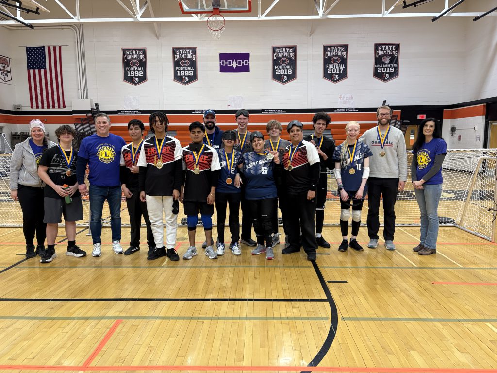 Group photo of Goalball athletes, coaches and event organizers 