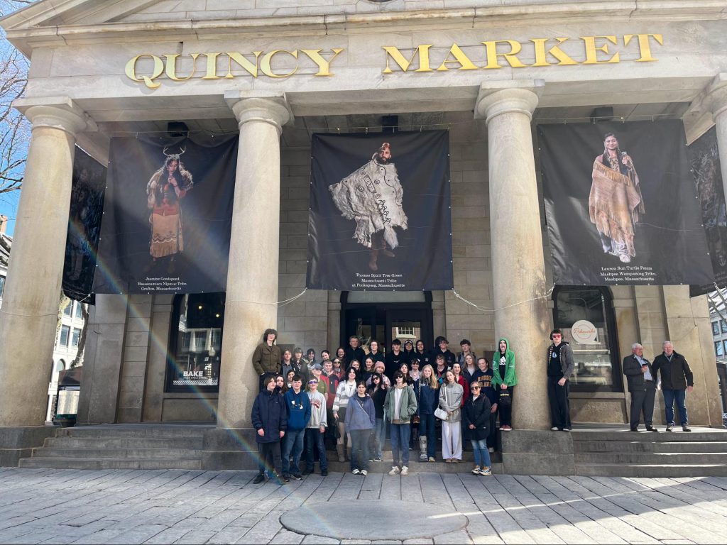 Group photo of Latin and Spanish students outside Quincy Market in Boston