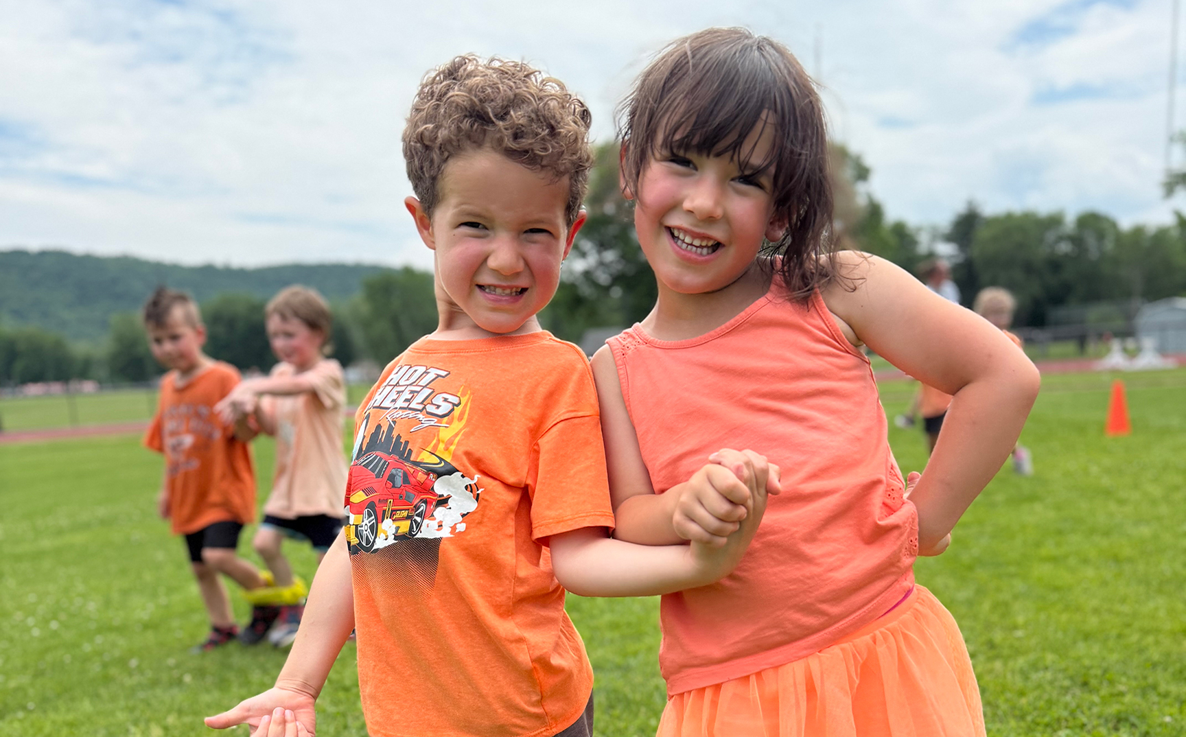 A boy and girl outside at field day