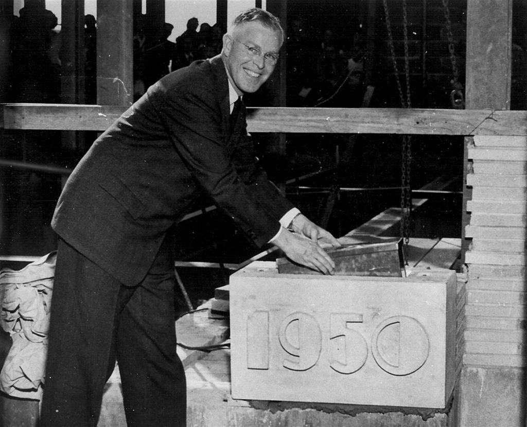 Clarence Coulter loading the time capsule at the new school
