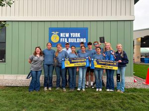 Students posing with their banners