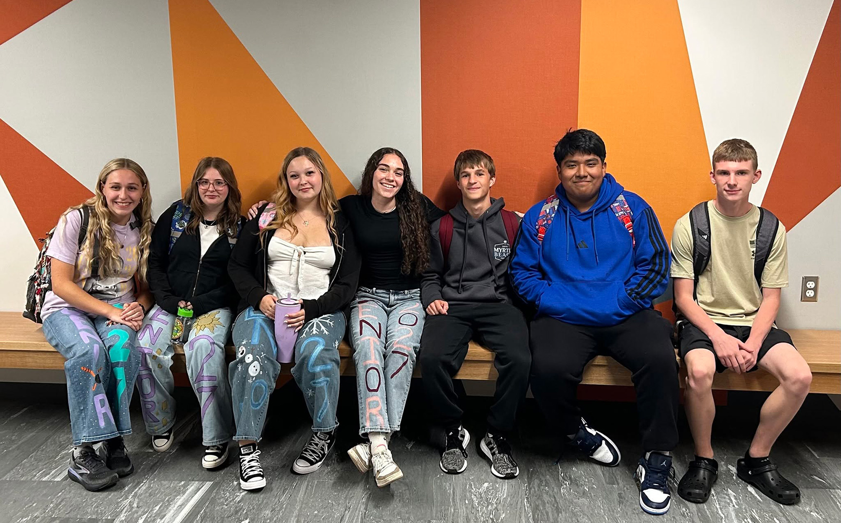 High school students sitting on a bench