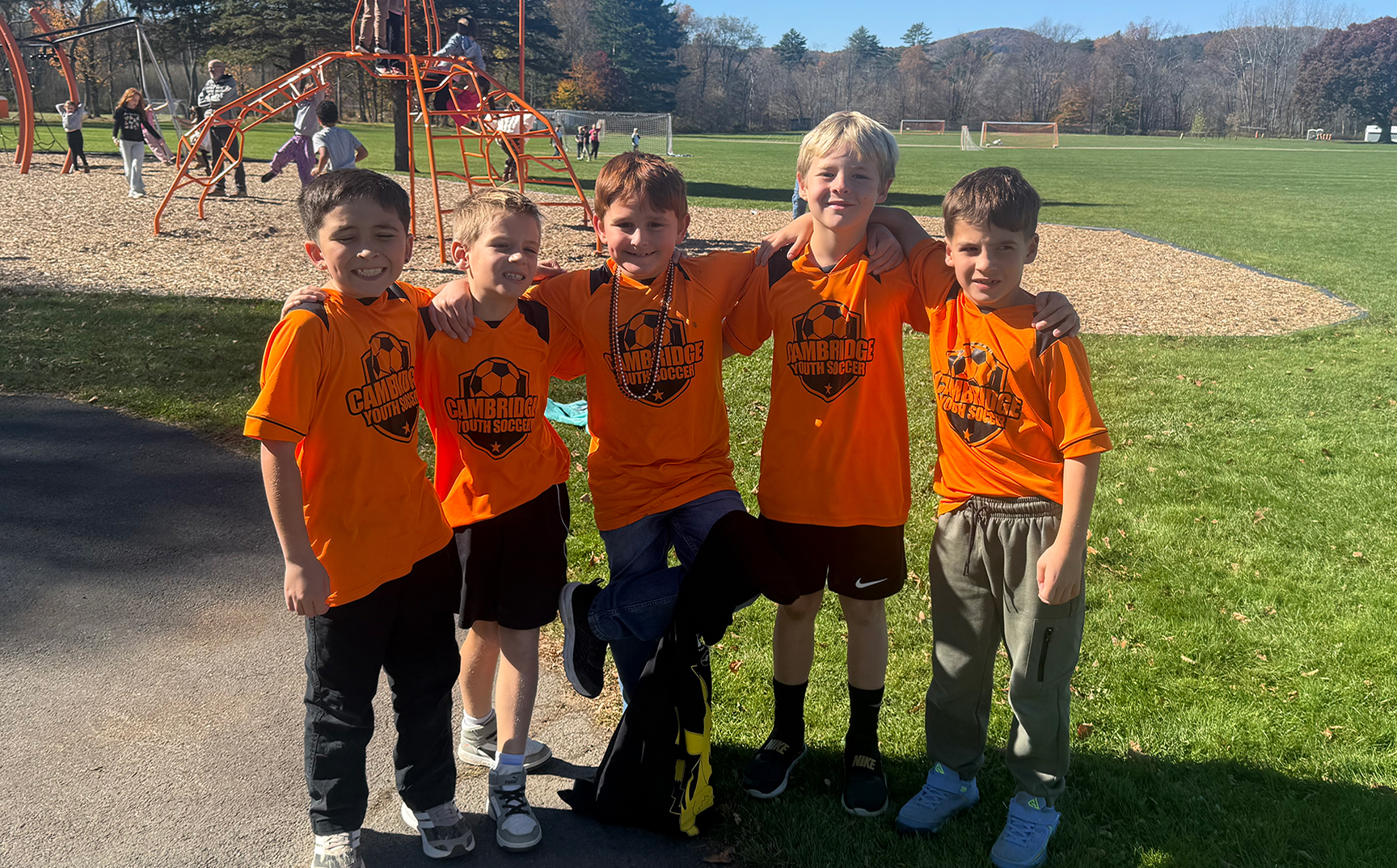 Elementary boys in their youth soccer jerseys